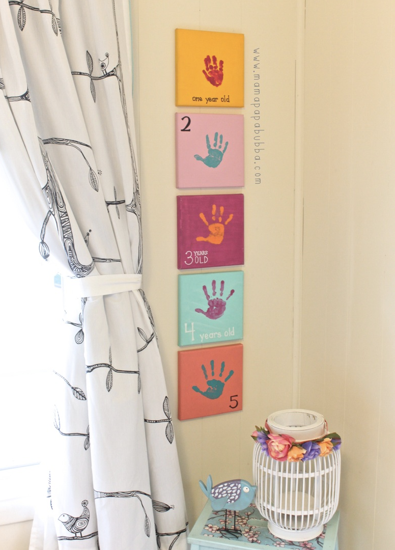 Fun hand print growing paintings for kids to do throughout the years of growth. 